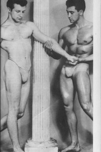 two muscle men posing together